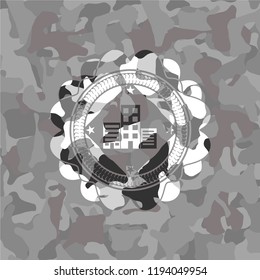 buildings icon inside grey camo emblem