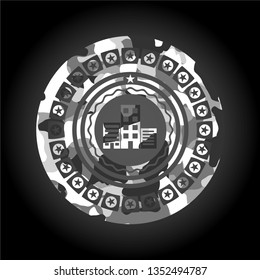 buildings icon inside grey camouflaged emblem