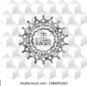 buildings icon inside grey icon or emblem with geometric cube white background