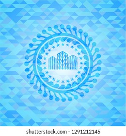 buildings icon inside light blue mosaic emblem