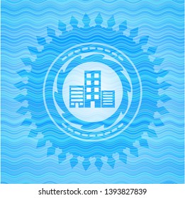buildings icon inside light blue water badge.