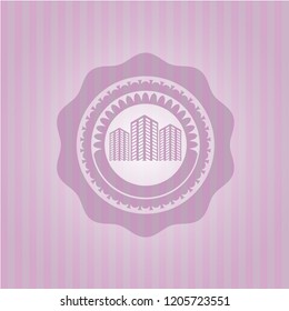 buildings icon inside pink emblem