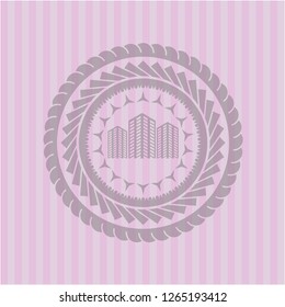 buildings icon inside pink emblem