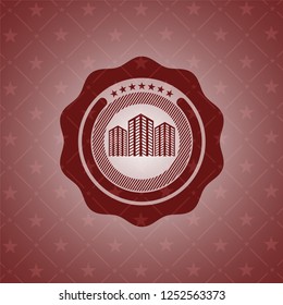buildings icon inside red emblem