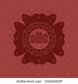 buildings icon inside red emblem