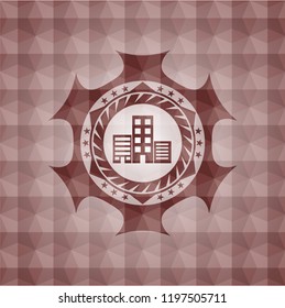 buildings icon inside red seamless emblem with geometric pattern background.