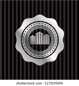 buildings icon inside silver badge or emblem