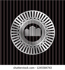 buildings icon inside silver badge or emblem