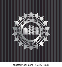 buildings icon inside silver badge or emblem