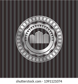 buildings icon inside silver emblem or badge