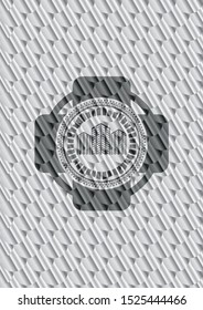 buildings icon inside silver shiny emblem. Scales pattern. Vector Illustration. Detailed.