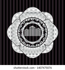 buildings icon inside silvery emblem or badge