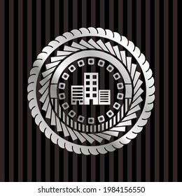 buildings icon inside silvery emblem or badge. 