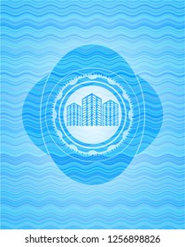 buildings icon inside sky blue water wave emblem background.