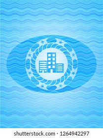 buildings icon inside sky blue water wave emblem background.