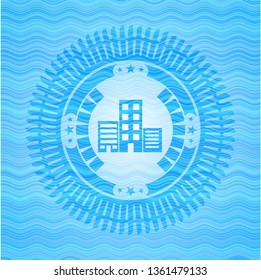 buildings icon inside water representation emblem.