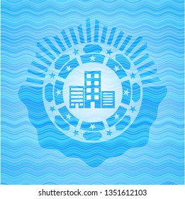 buildings icon inside water wave concept emblem background.