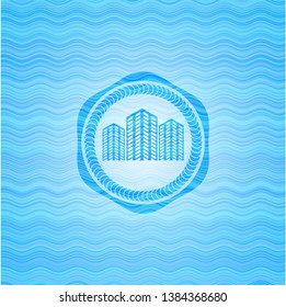 buildings icon inside water wave concept badge.