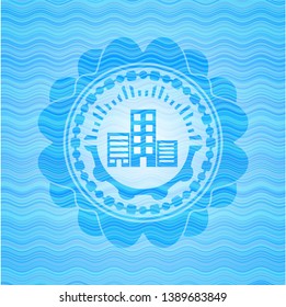 buildings icon inside water wave concept emblem background.
