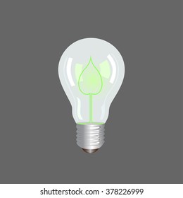 Bulb light with glowing leaflet  inside on grey background.