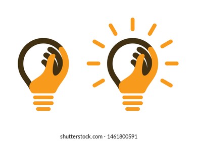 Bulbs with human hand and light beams. Creative idea icons.