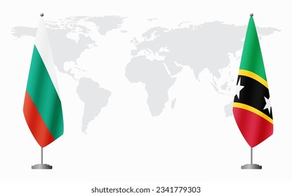Bulgaria and Saint Kitts and Nevis flags for official meeting against background of world map.