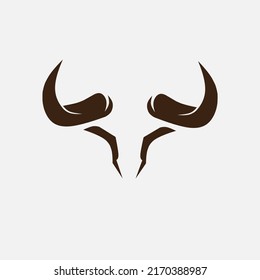 Bull minimalist logo. Simple negative space vector design. Isolated with soft background.