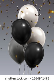 Montón de globos sobre fondo gris. Globos negros, blancos y grises. Fondo de la celebración. 