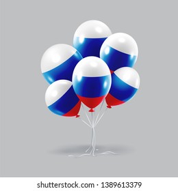 Bunch of glossy bright russian flag balloons hanging over neutral gray background. 