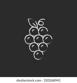 Bunch of grapes hand drawn in chalk on a blackboard vector white icon isolated on a black background.