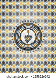 bunch of grapes icon inside arabesque badge background. arabic decoration.