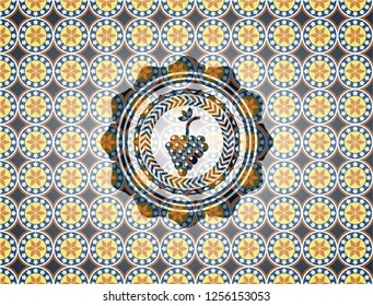 bunch of grapes icon inside arabic style badge. Arabesque decoration.