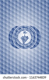 bunch of grapes icon inside blue emblem with geometric pattern background.