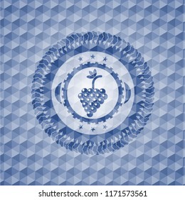 bunch of grapes icon inside blue badge with geometric background.
