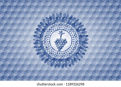 bunch of grapes icon inside blue emblem or badge with abstract geometric polygonal pattern background.