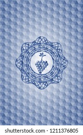 bunch of grapes icon inside blue emblem or badge with abstract geometric polygonal pattern background.