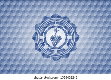 bunch of grapes icon inside blue emblem or badge with geometric pattern background.