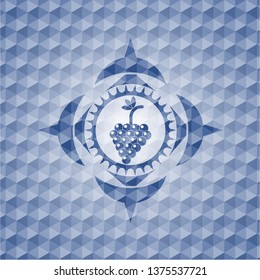 bunch of grapes icon inside blue emblem with geometric pattern.
