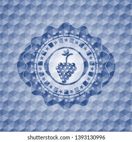bunch of grapes icon inside blue emblem or badge with geometric pattern background.