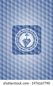 bunch of grapes icon inside blue badge with geometric background. 