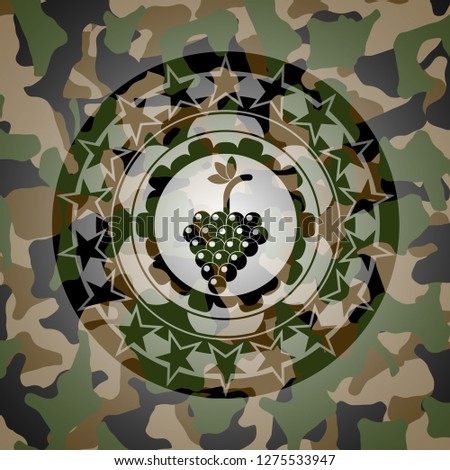 bunch of grapes icon inside camouflaged emblem