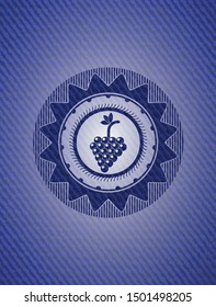 bunch of grapes icon inside denim background