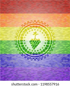 bunch of grapes icon inside emblem on mosaic background with the colors of the LGBT flag