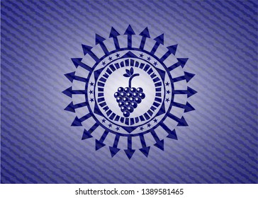 bunch of grapes icon inside emblem with denim high quality background