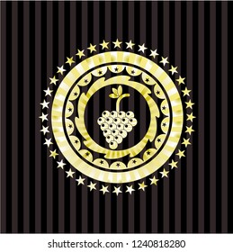 bunch of grapes icon inside gold shiny emblem