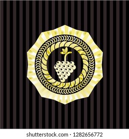 bunch of grapes icon inside gold shiny emblem