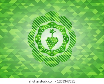 bunch of grapes icon inside green mosaic emblem