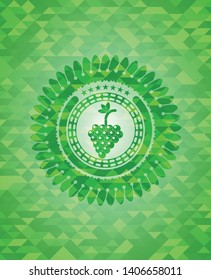 bunch of grapes icon inside green emblem with mosaic ecological style background