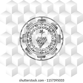bunch of grapes icon inside grey emblem with geometric cube white background