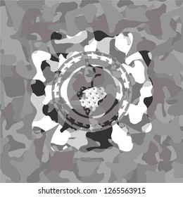 bunch of grapes icon inside grey camo emblem